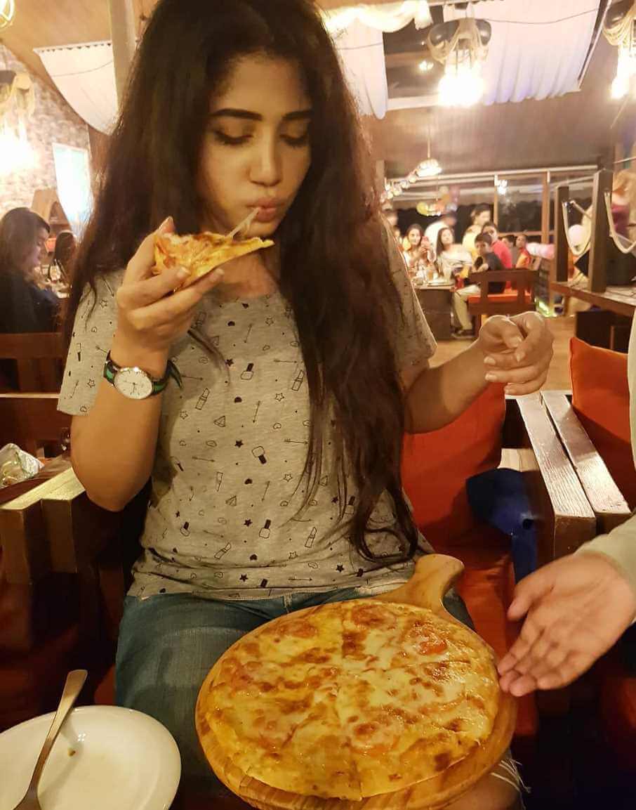 Shahtaj Monira Hashem with Pizza